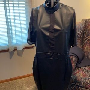 “The Curve” by Judani, mesh sleeves and cutout 2” front detail leather look .